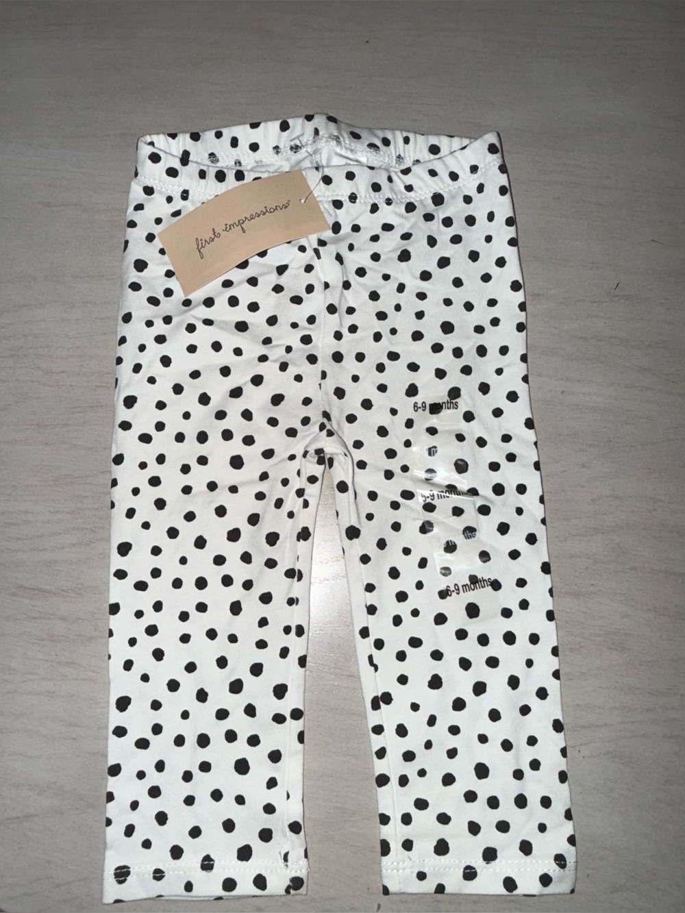 Kids- First Impressions White Leggings with Black Polka Dot Print
